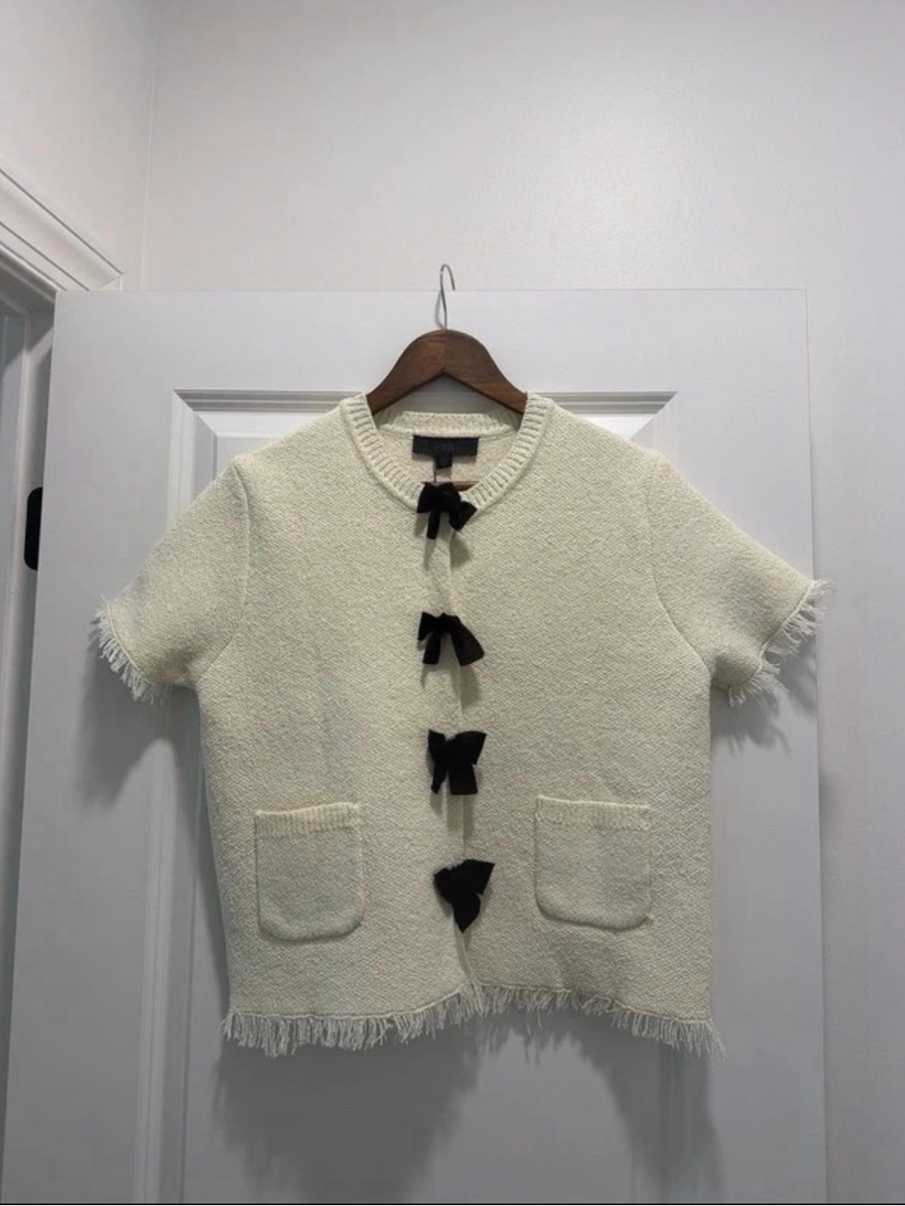 Zara Ivory Short-Sleeve Bouclé Cardigan with Black Bow Closures